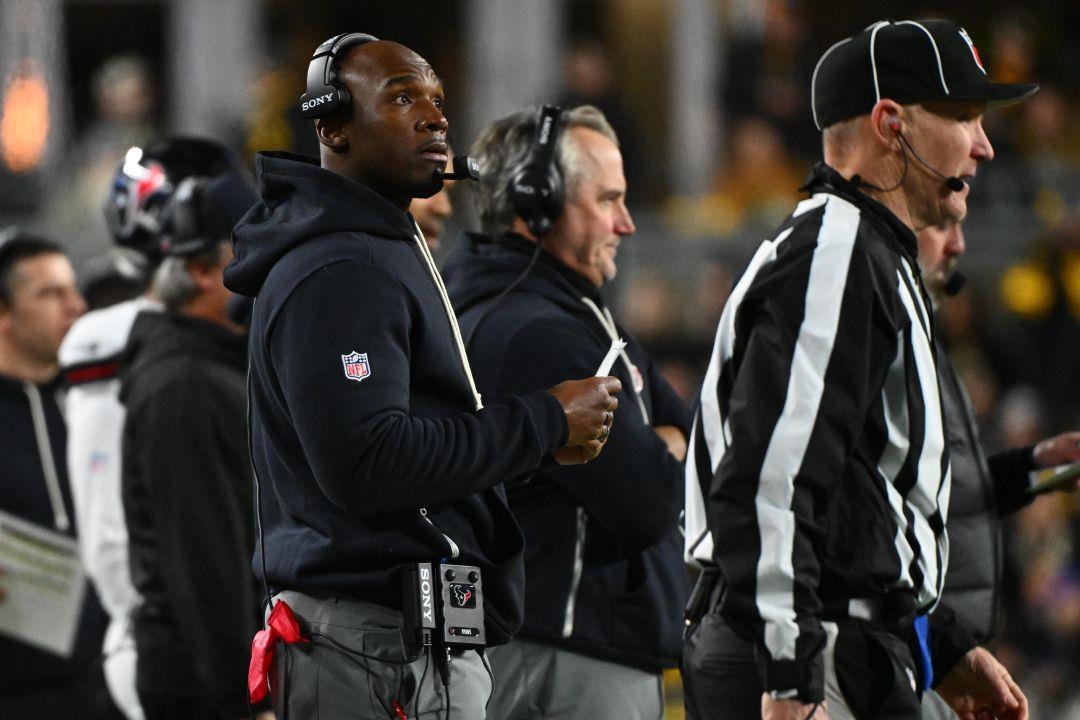 Houston Texans head coach DeMeco Ryans, left, stands on the sideline during the first half of an NFL wild-card playoff football game against the Houston Texans, Monday, Jan. 12, 2026, in Pittsburgh. (